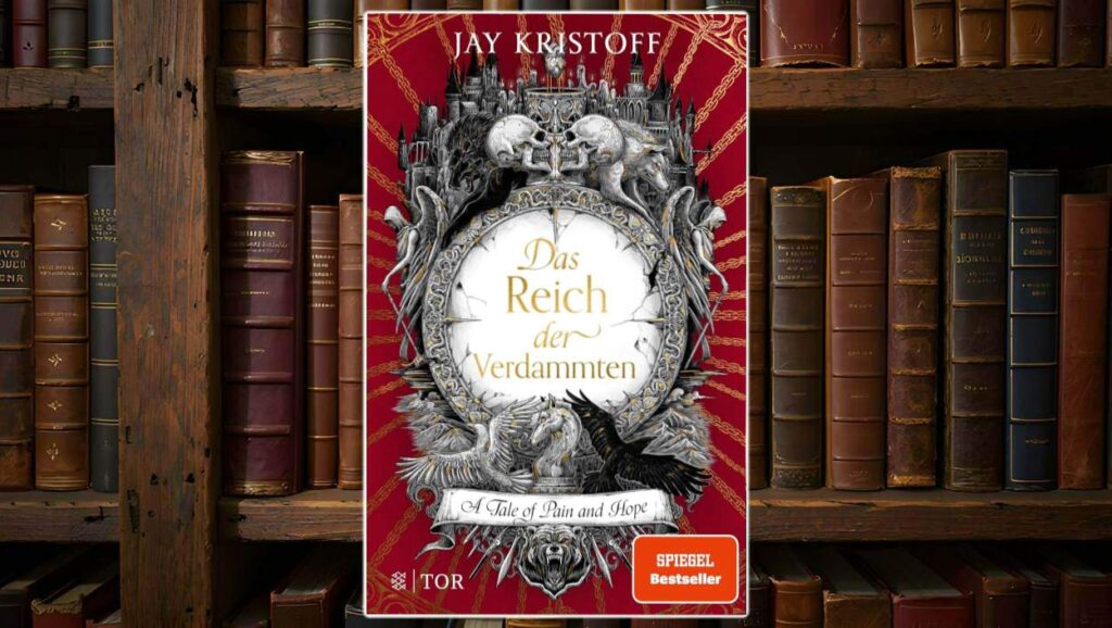 Buchcover von Das Reich der Verdammten von Jay Kristoff: Prunkvoll gestaltetes Cover mit barockem Rahmen, Totenschädeln, Engelsfiguren, Wölfen, geflügelten Pferden und einer düsteren Stadt auf blutrotem Hintergrund mit goldenen Ketten. In der Mitte der Titel in goldener Schrift, unten ein Banner mit dem englischen Untertitel ‚A Tale of Pain and Hope‘. Rechtes Eck: SPIEGEL-Bestseller-Label.