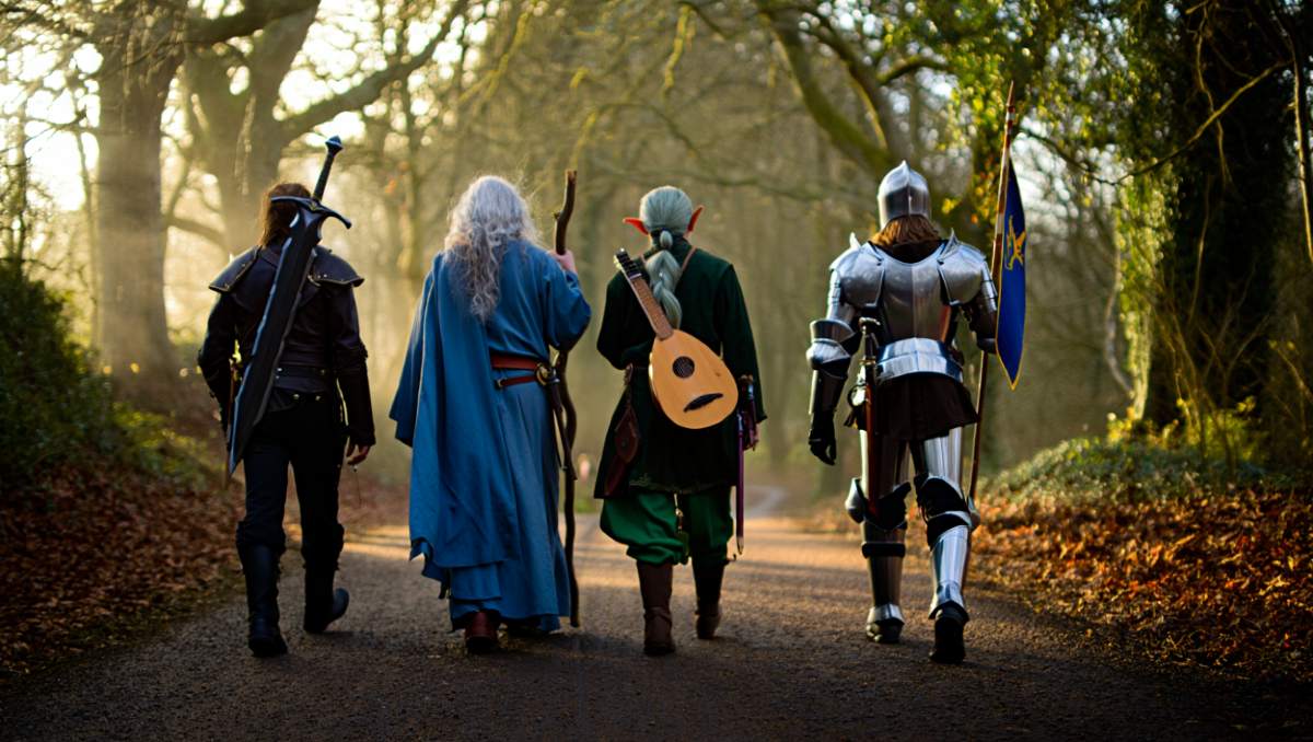 Bild: Eine Gruppe unterschiedlicher Fantasyabenteurer auf dem Weg zu einer neuen Quiest. Ein Waldweg im Hintergrund.
