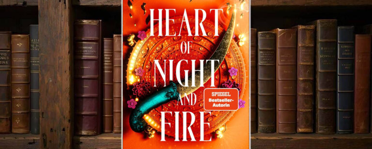 Cover von Heart of Night and Fire von Nisha J. Tuli: leuchtend orange-rote Farbpalette mit goldverziertem Rundschild und geschwungenem Dolch, umrahmt von kleinen Blüten. Zentrale Fantasy-Optik, prunkvoll und ornamental, typisches Farbschnitt-Design für eine Romantasy-Erstausgabe.