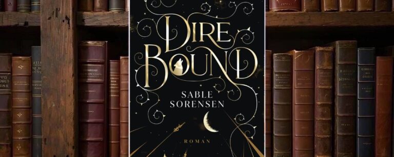 Buchcover von »Dire Bound«: schwarzer Hintergrund mit feinen goldenen Sternen und Rankenornamenten. Der Titel „Dire Bound“ steht in großer, geschwungener Goldschrift, im Buchstaben O ist die Silhouette eines heulenden Wolfs zu sehen. Darunter der Name „Sable Sorensen“ in weißer Serifenschrift. Im unteren Drittel ragen goldene Gräser und Halme in die Dunkelheit, über ihnen eine halb verhüllte, sichelförmige goldene Mondscheibe; unten das Goldmann-Logo.