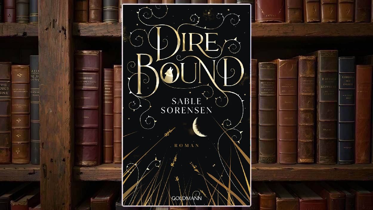 Buchcover von »Dire Bound«: schwarzer Hintergrund mit feinen goldenen Sternen und Rankenornamenten. Der Titel „Dire Bound“ steht in großer, geschwungener Goldschrift, im Buchstaben O ist die Silhouette eines heulenden Wolfs zu sehen. Darunter der Name „Sable Sorensen“ in weißer Serifenschrift. Im unteren Drittel ragen goldene Gräser und Halme in die Dunkelheit, über ihnen eine halb verhüllte, sichelförmige goldene Mondscheibe; unten das Goldmann-Logo.