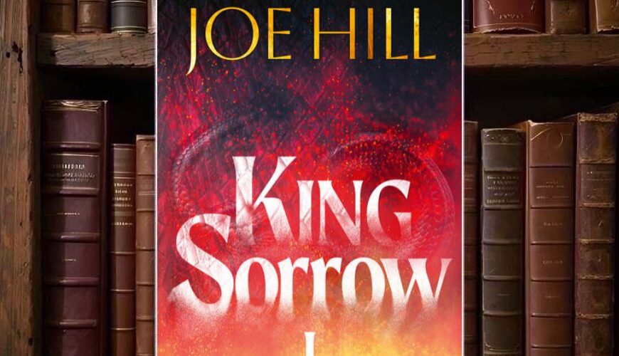 Dunkelblaues Cover von King Sorrow I mit stilisierten orange-roten Flammen auf fast schwarzem Grund; darüber und mittig große weiße Typografie mit Autorennamen und Titel.