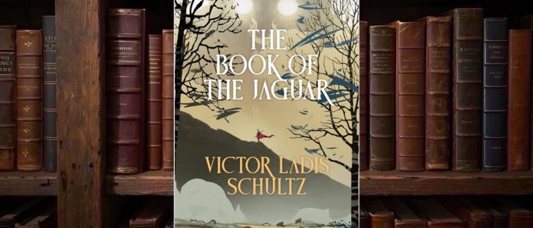 Cover von Victor Ladis Schultz’ The Book of the Jaguar mit einem riesigen schemenhaften Jaguargesicht und leuchtenden hellen Augen im Nebel über einer kleinen rot gekleideten Figur auf einem felsigen Pfad, eingerahmt von dunklen kahlen Bäumen.