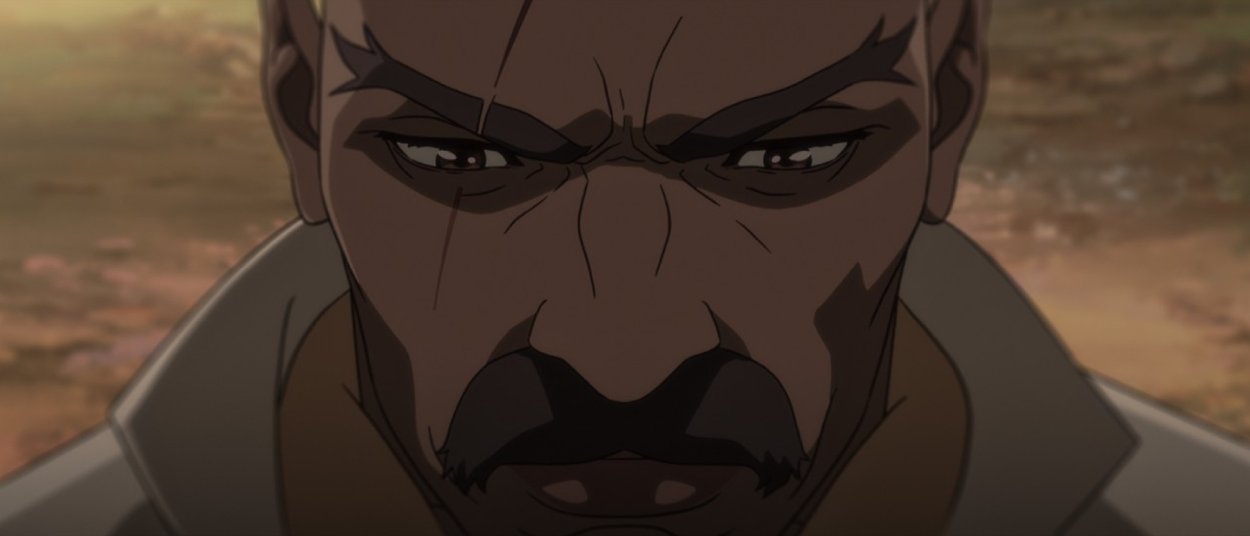 Nahaufnahme von Bass mit ernstem Blick und Schnurrbart in einer animierten Szene aus Bass X Machina.