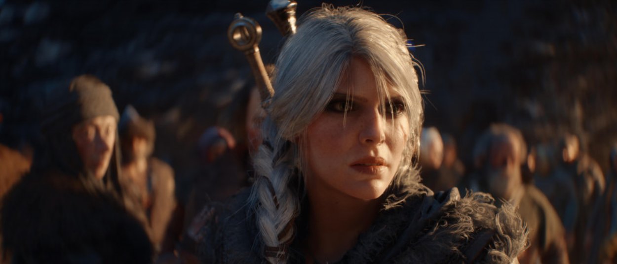 Ciri steht in dunkler Hexerrüstung vor mehreren Bewohnern eines mittelalterlichen Dorfes im offiziellen Material zu The Witcher IV.