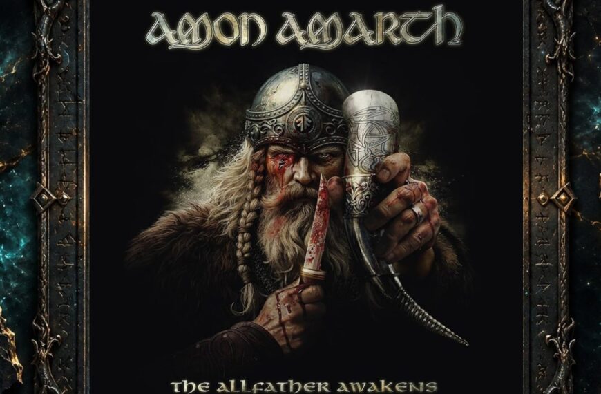 Albumcover von Amon Amarth – The Allfather Awakens: Odin blickt frontal aus schwarzem Hintergrund hervor. Er trägt einen verzierten Helm, sein rechtes Auge ist blutig verletzt. In einer Hand hält er ein reich dekoriertes Trinkhorn, in der anderen ein blutverschmiertes Messer. Über ihm steht das Bandlogo, darunter der Albumtitel.
