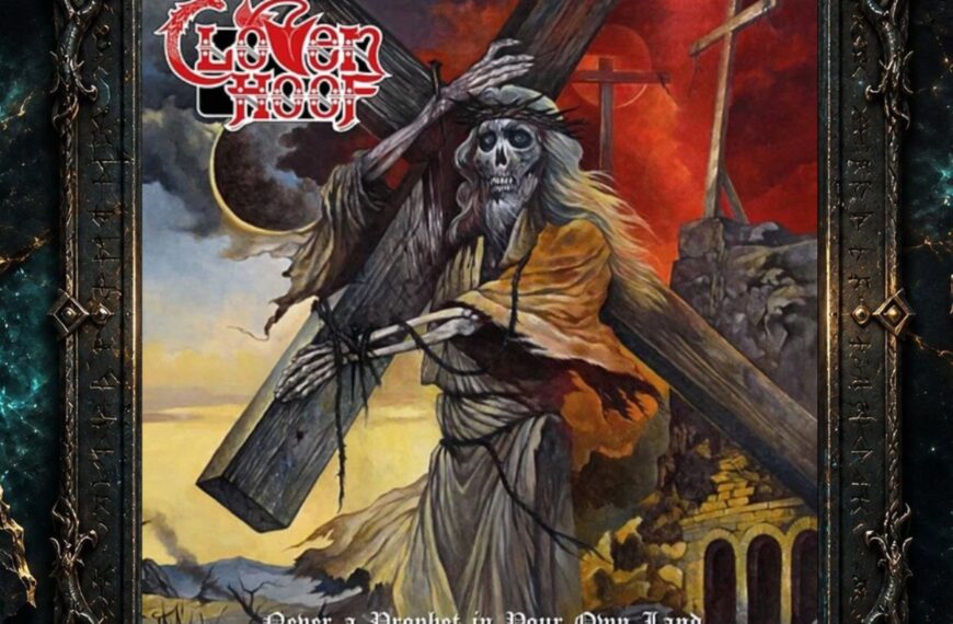 Albumcover von Cloven Hoof – Never A Prophet In Your Own Land: Eine skelettierte Christusfigur trägt ein großes Holzkreuz durch eine düstere Landschaft. Im Hintergrund stehen weitere Kreuze, der Himmel glüht rot und dunkel, links ist eine Sonnenfinsternis zu sehen.