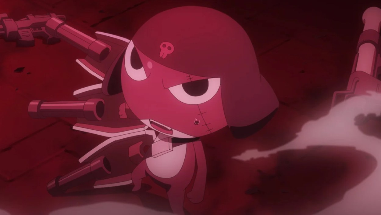 Keroro steht in rotem Licht vor mehreren futuristischen Waffen und Maschinen in einer düsteren Szene.