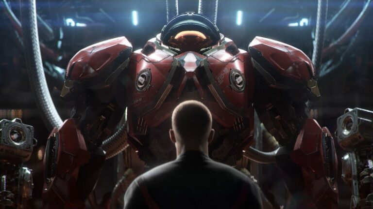 Ein Mann steht in einem futuristischen Hangar vor einer gewaltigen roten Terran-Kampfrüstung aus dem neuen StarCraft.